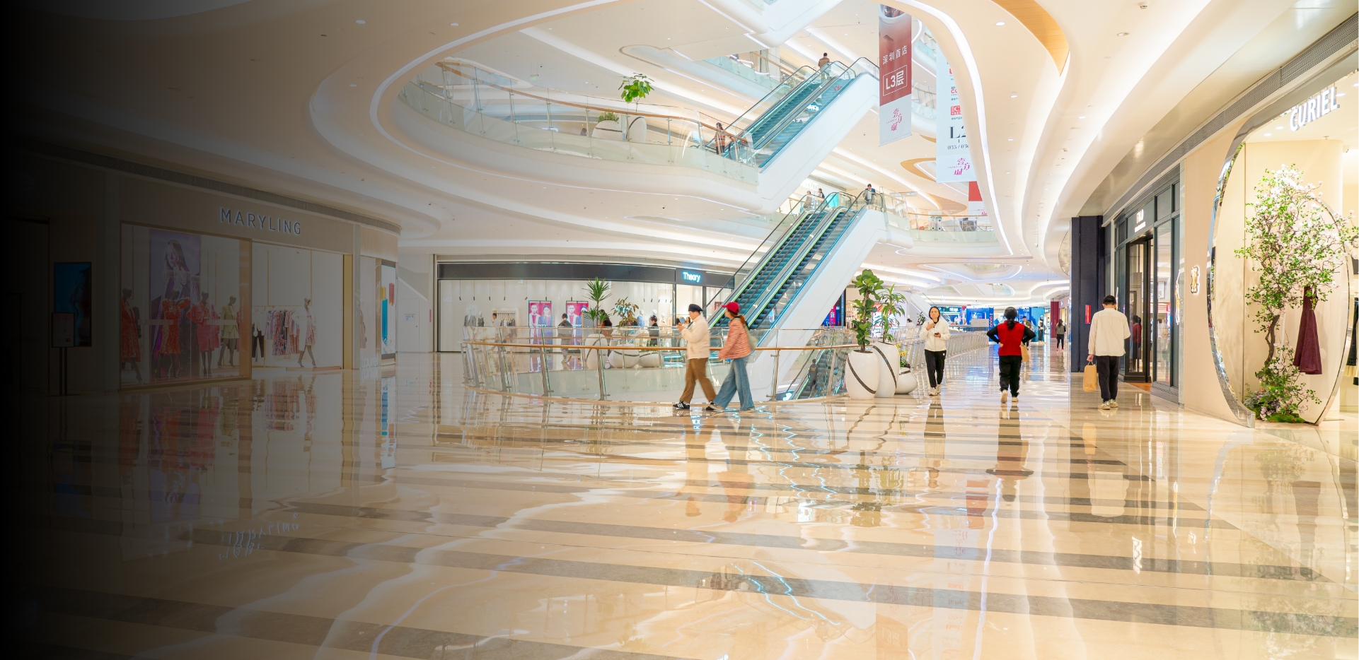 Customers walking inside a modern shopping mall