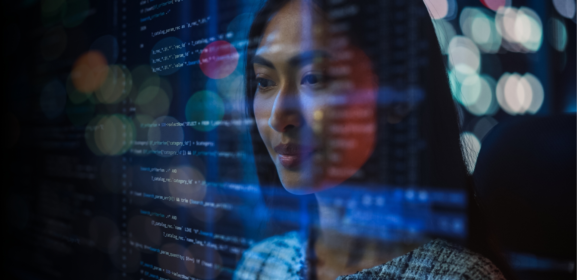 A woman examining lines of code